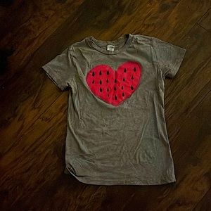 I am selling a grey T-shirt with a heart watermelon! It’s so cute! Size 12
